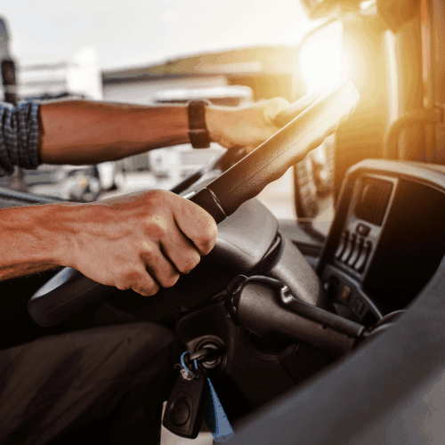 Hands on a truck wheel