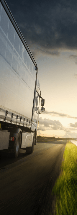 back angle shot of a grey truck in the countryside