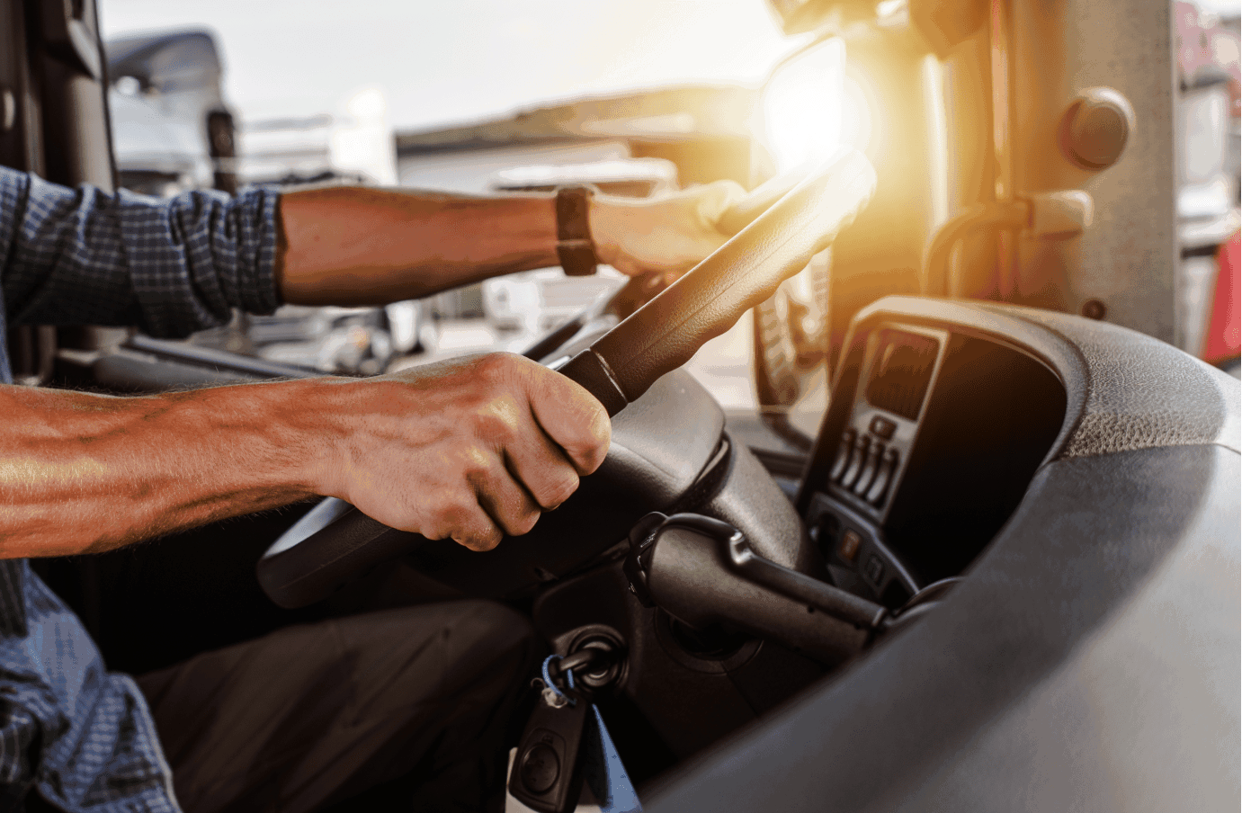 Hands on a truck wheel