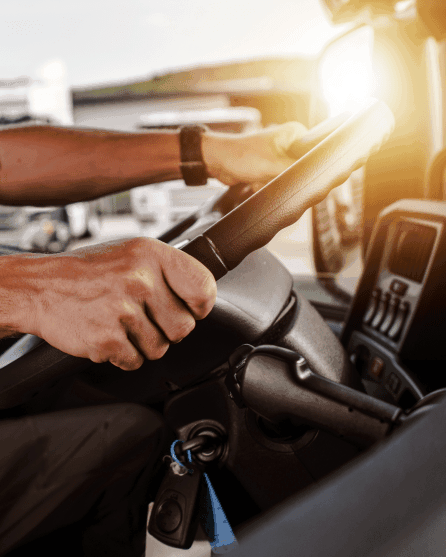 Hands on a truck steering wheel