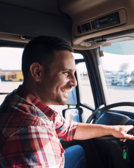 Smiling truck driver with checked shirt